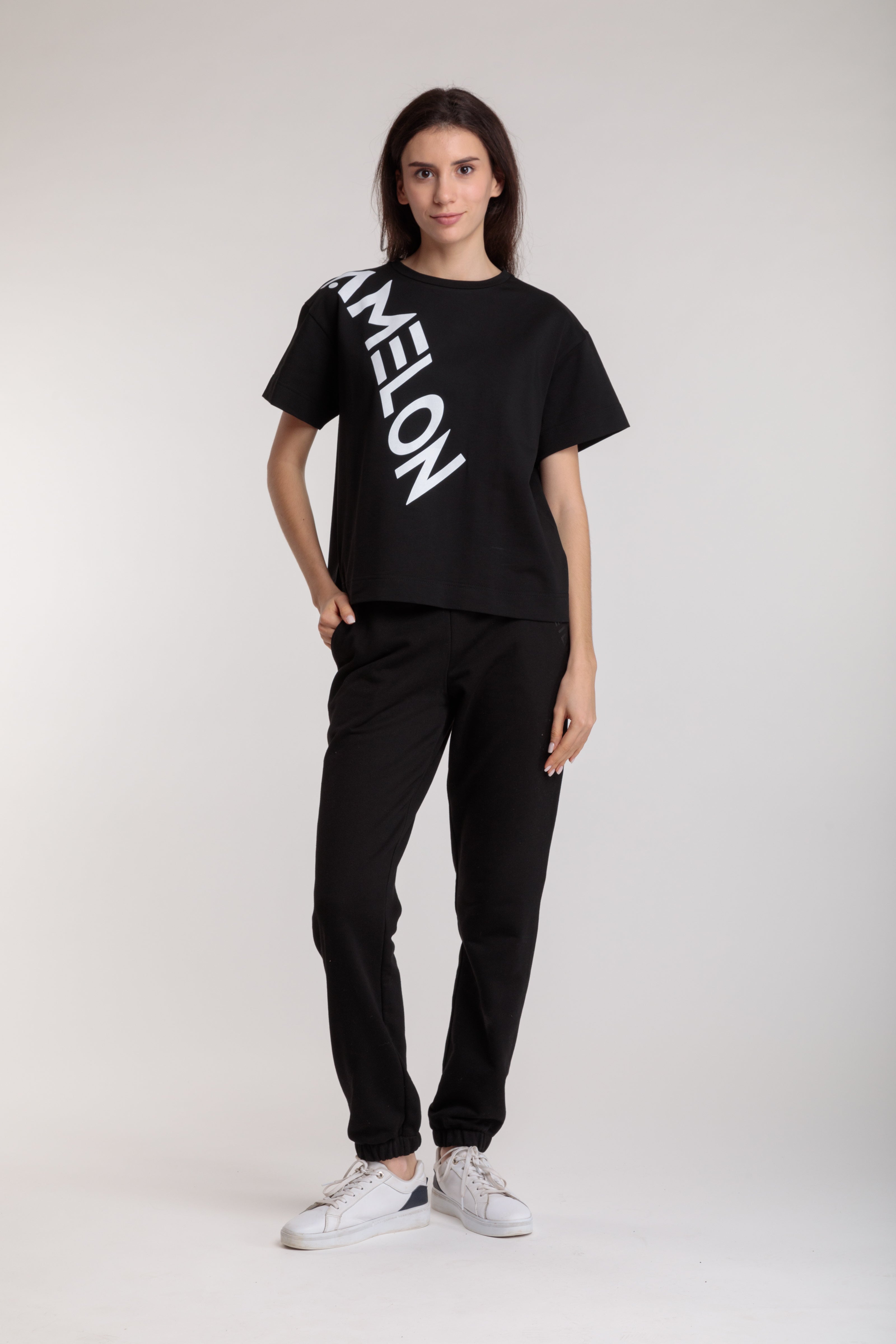 Women's straight black t-shirt with a large white lettering