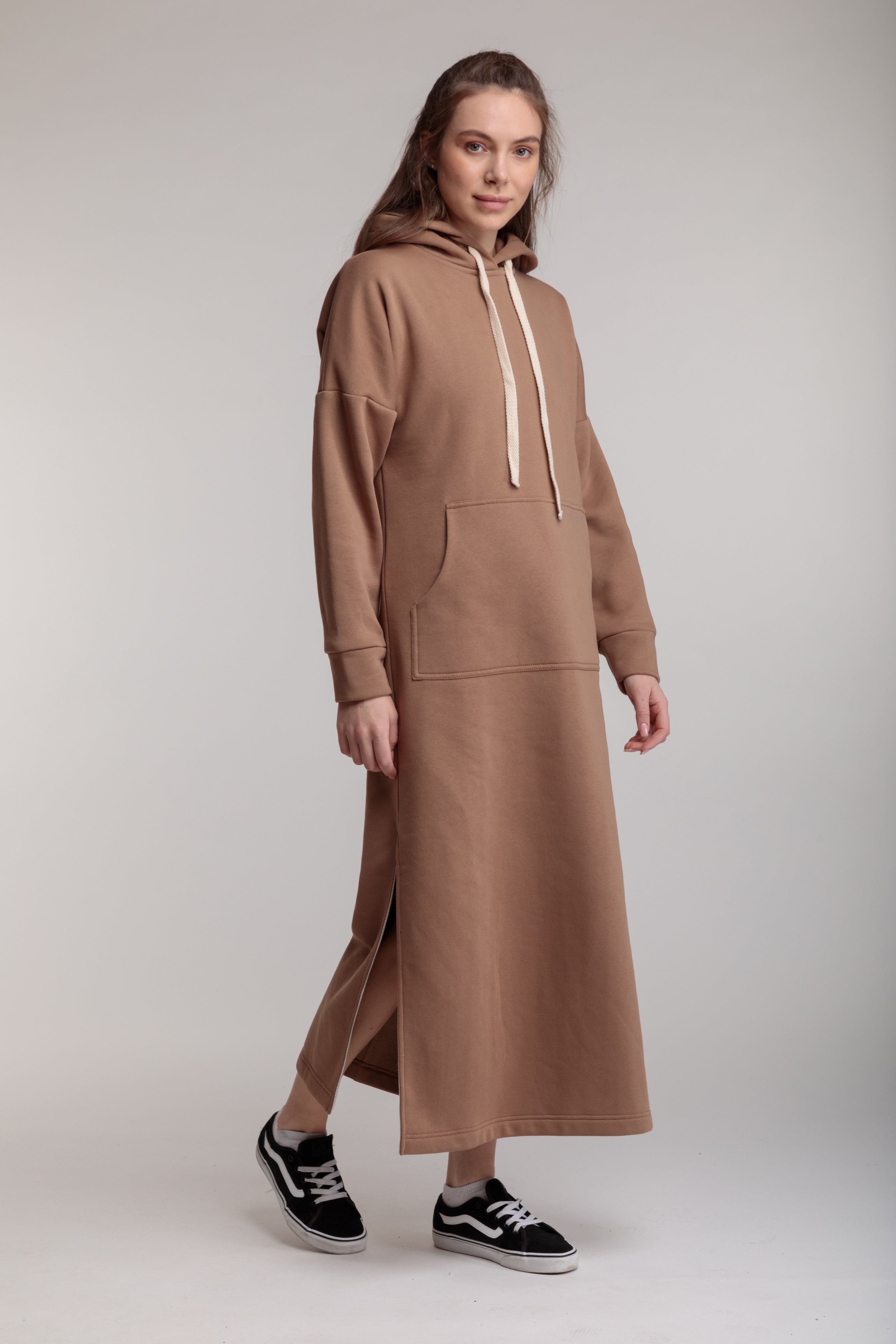 Long straight warm dress in beige color with slits, hood and pocket