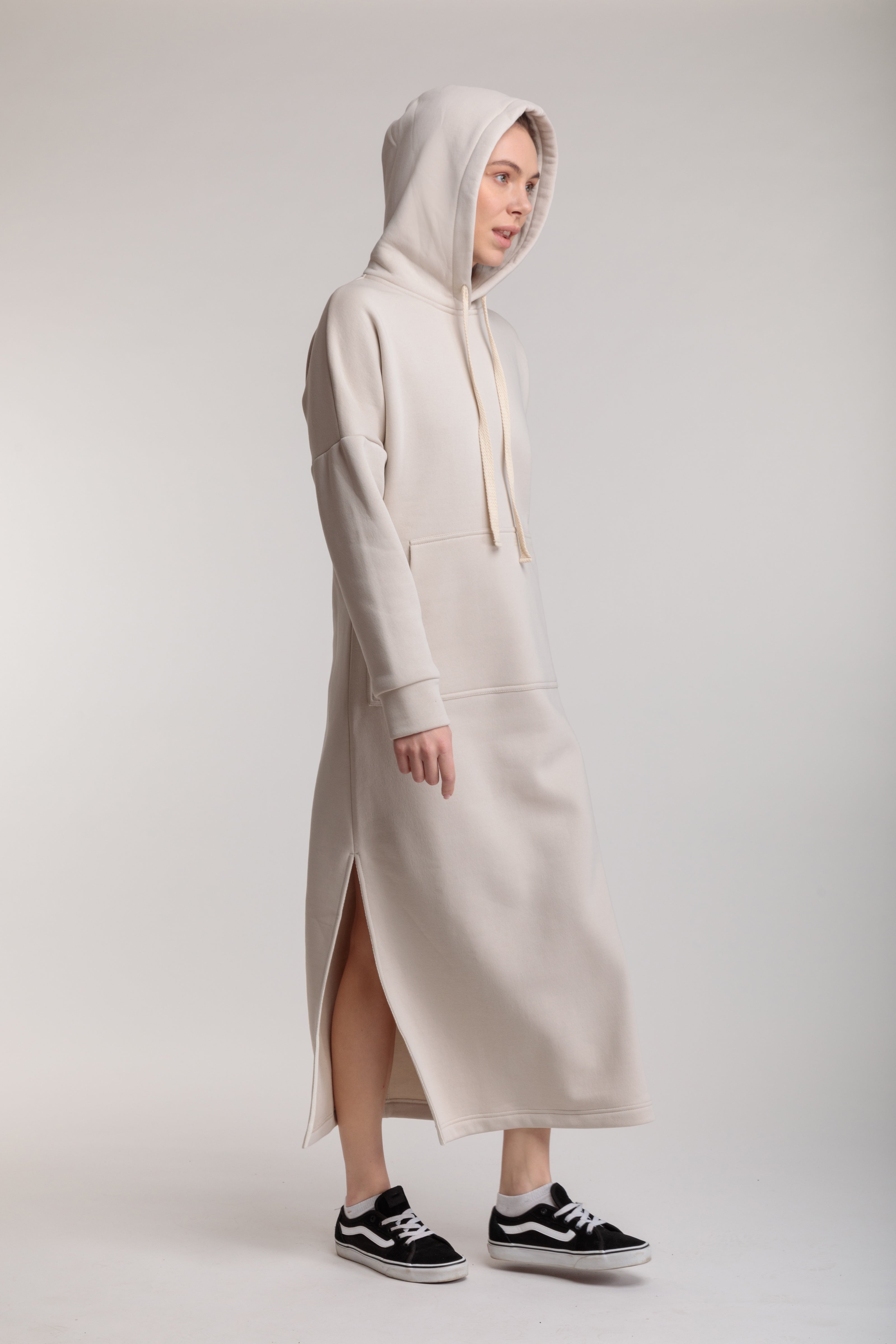 Long straight warm dress in milk color with slits, hood and pocket