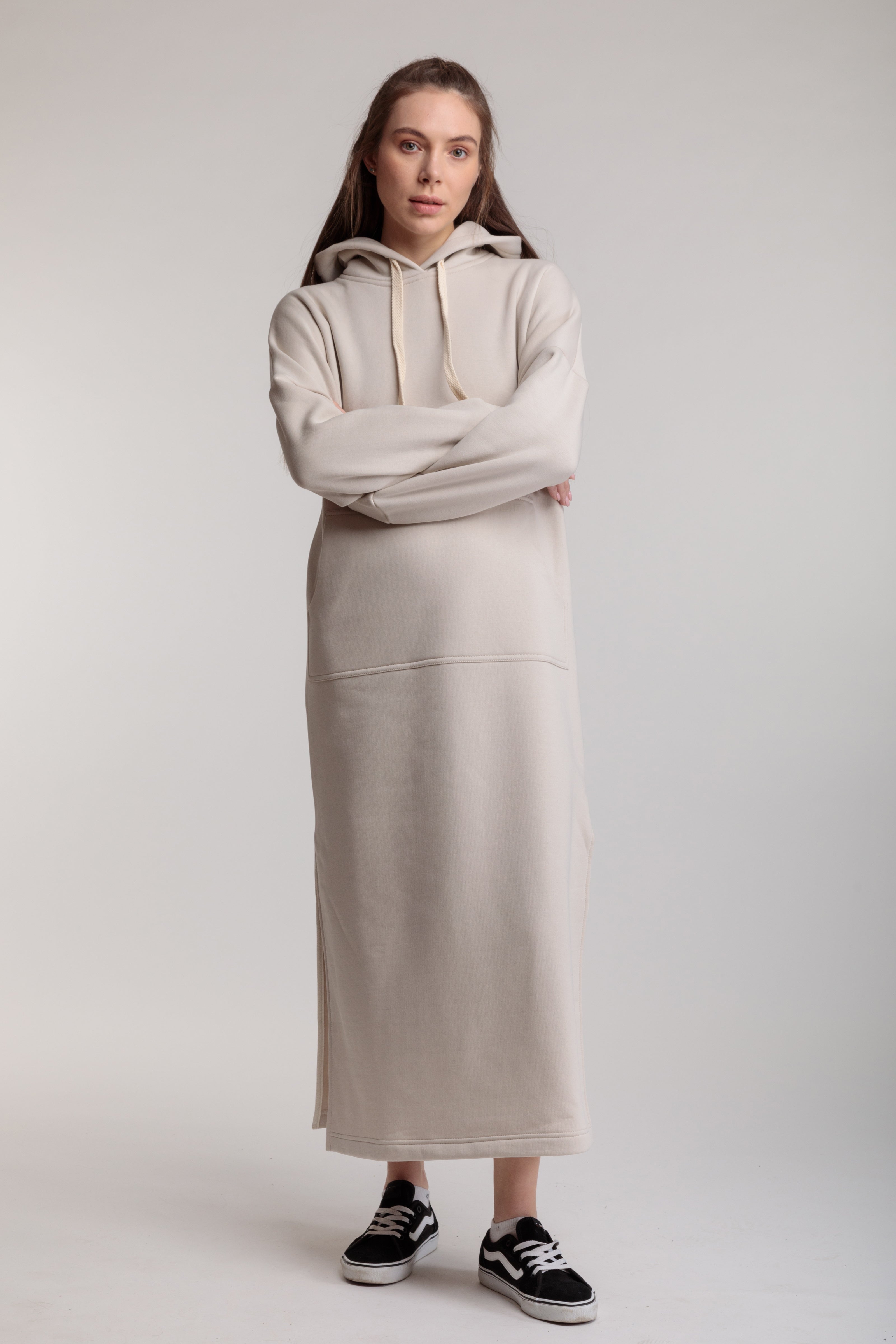 Long straight warm hooded dress in milk color with slits, and a kangaroo pocket