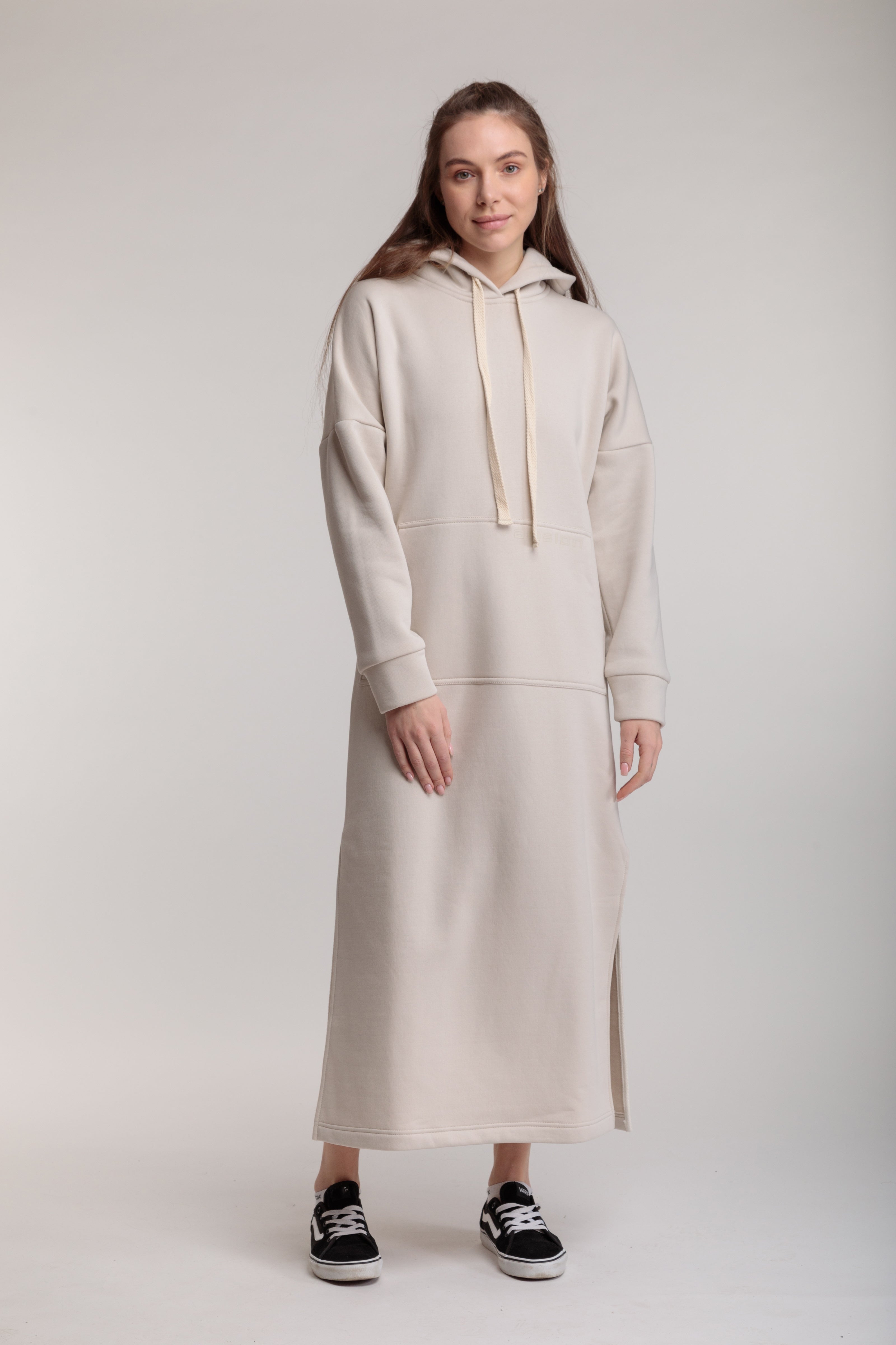 Long straight warm hooded dress in milk color with slits, and a kangaroo pocket