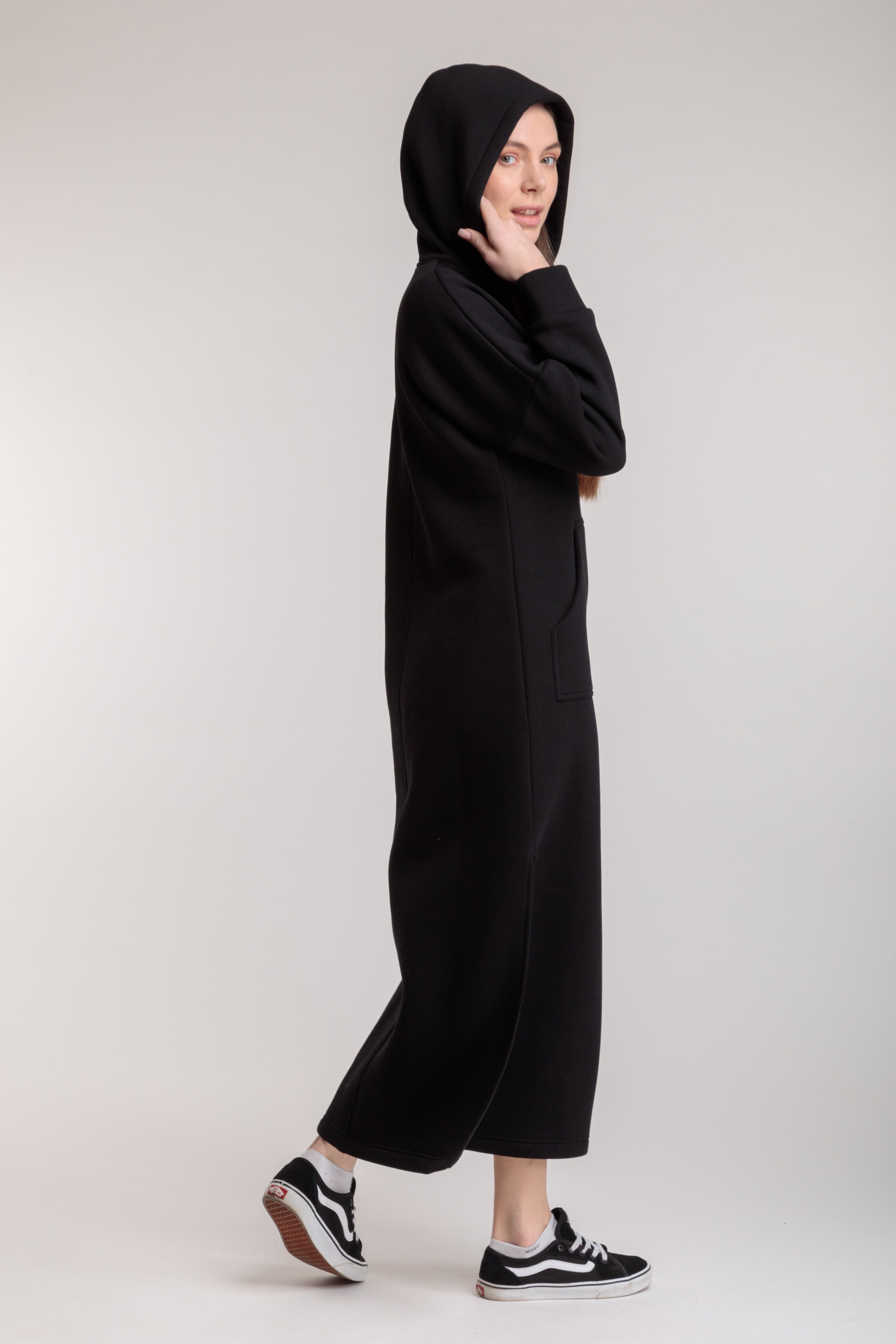 Long straight warm hooded dress in black color with slits, and a kangaroo pocket