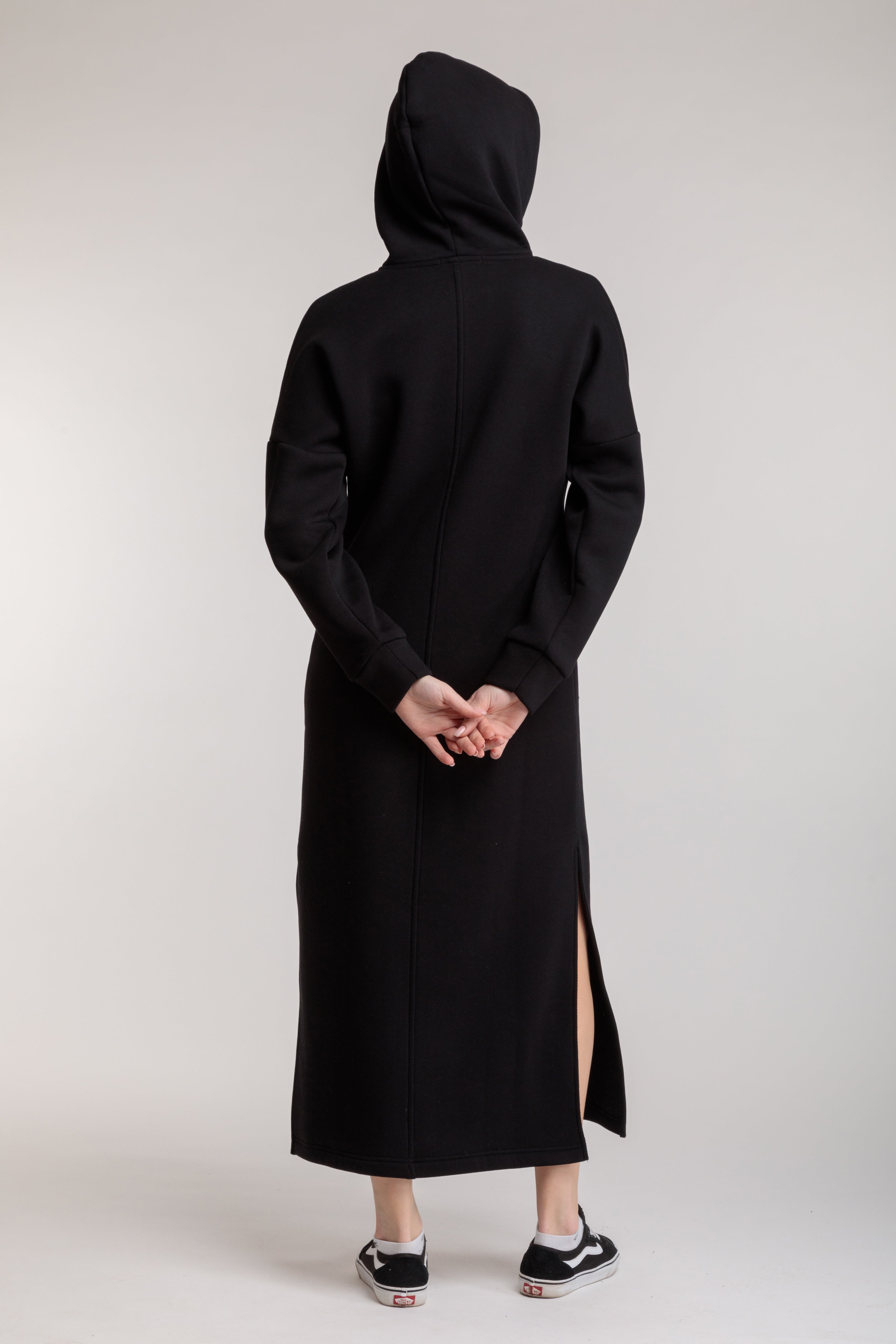 Long straight warm hooded dress in black color with slits, and a kangaroo pocket