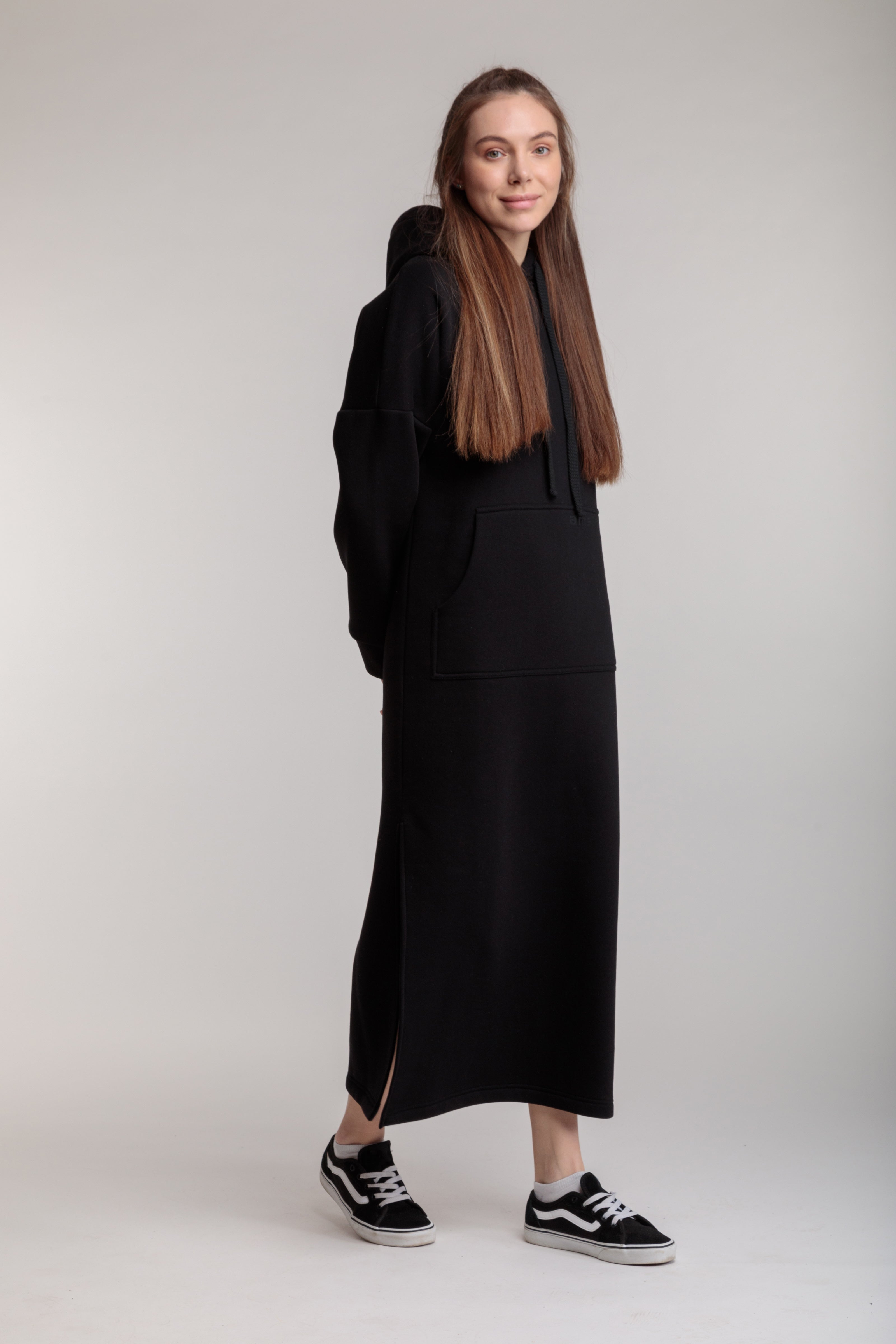 Long straight warm dress in black color with slits, hood and pocket