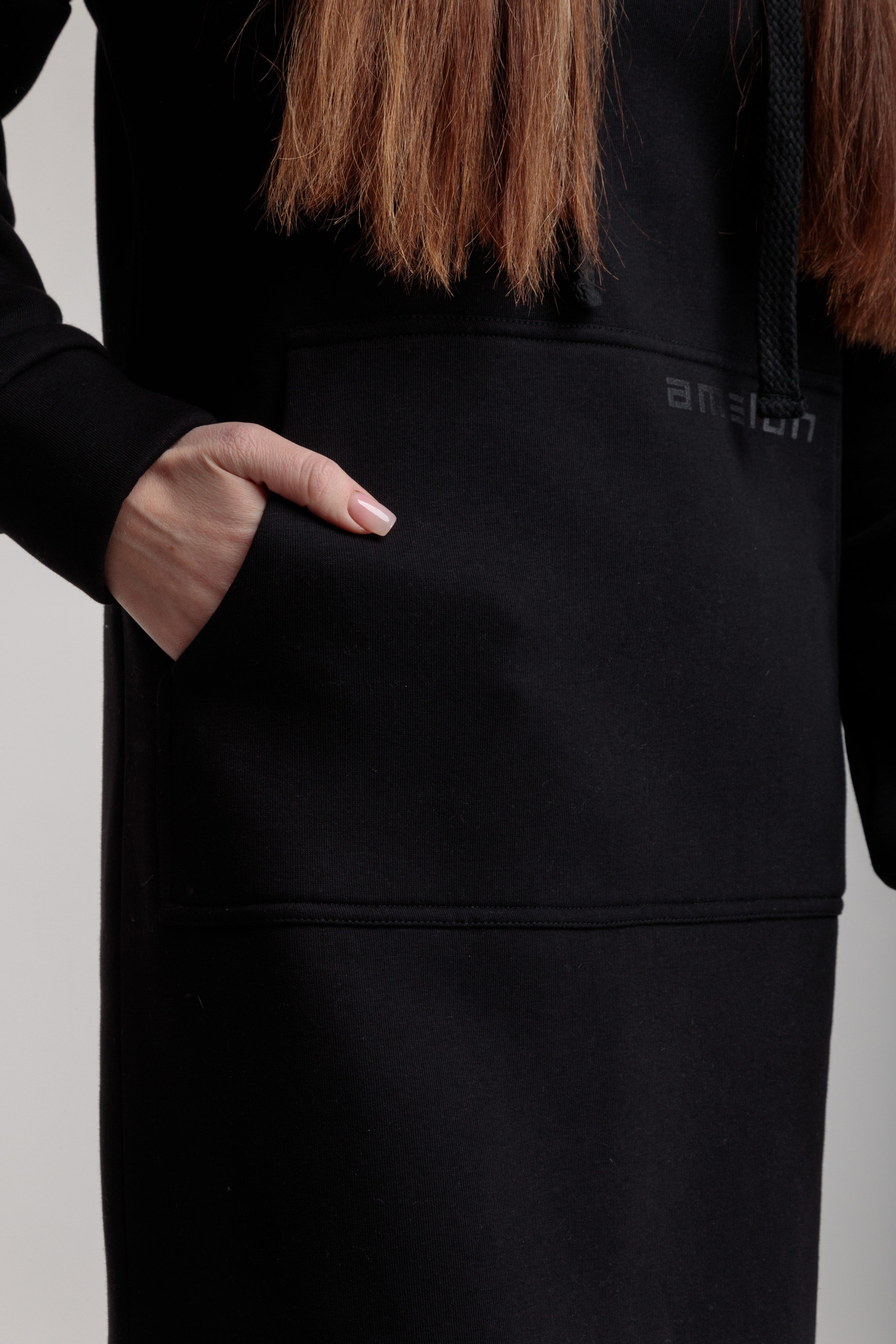 Long straight warm hooded dress in black color with slits, and a kangaroo pocket